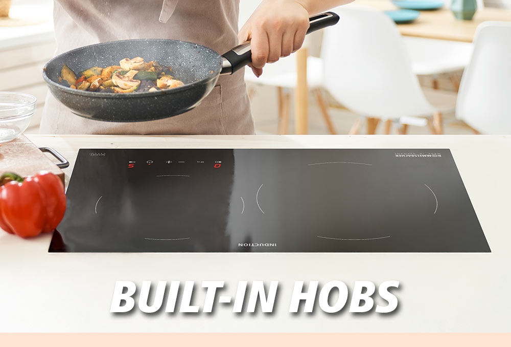 A black, modern induction built-in hob with two cooking zones. A pan with sautéed vegetables is placed on it. The text in the image reads: “BUILT-IN HOBS”.