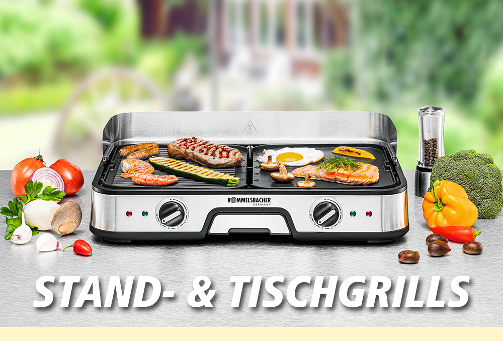 Ein silberner Stand- und Tischgrill mit zwei Grillplatten, belegt mit Gemüse, Spiegelei und Fischfilets. Umgeben von Gewürzen, Brokkoli und Paprika. Im Bild steht in weißer Schrift: „STAND- & TISCHGRILLS“.