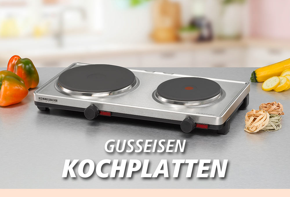 Eine silberne Kochplatte mit zwei runden Gusseisenplatten. Daneben liegen bunte Paprika und ungekochte Nudeln. Im Bild steht in weißer Schrift: „GUSSEISEN KOCHPLATTEN“.
