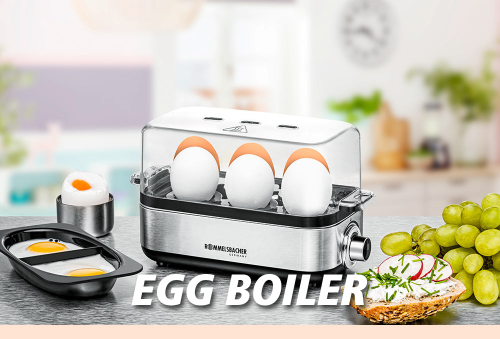 A silver egg boiler with a transparent lid, containing six eggs. Next to it, a boiled egg, a tray with two fried eggs, and a slice of bread with cream cheese and radishes. The text in the image reads: “EGG BOILER”.